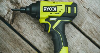green and black cordless hand drill